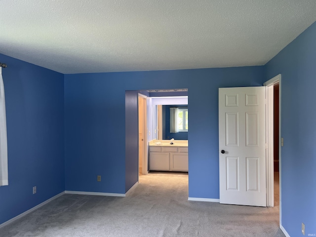 4501 N Wheeling Ave, Muncie, IN 47304 - unfurnished bedroom featuring a textured ceiling and carpet flooring