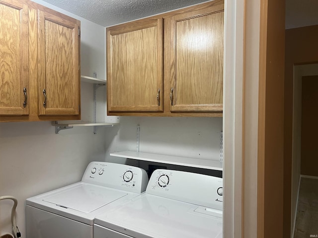 4501 N Wheeling Ave, Muncie, IN 47304 - washroom featuring independent washer and dryer, cabinet space, and a textured ceiling