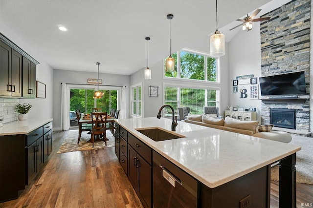 907 Switchfoot Dr, Huntertown, IN 46748 - kitchen with dishwasher, dark wood-type flooring, ceiling fan, open floor plan, and recessed lighting