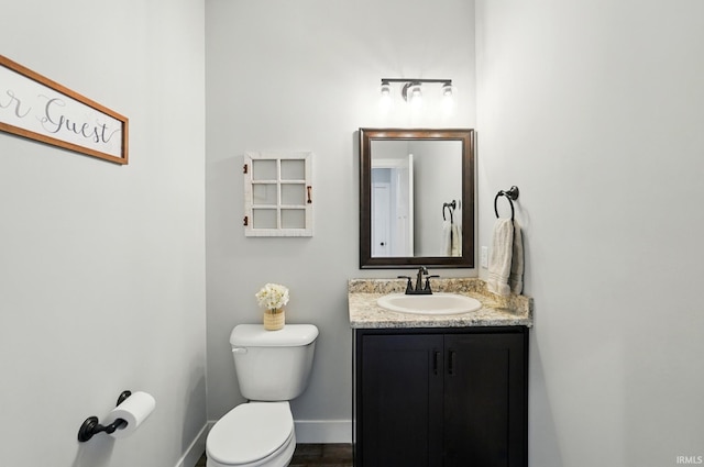 907 Switchfoot Dr, Huntertown, IN 46748 - half bathroom with vanity and wood finished floors
