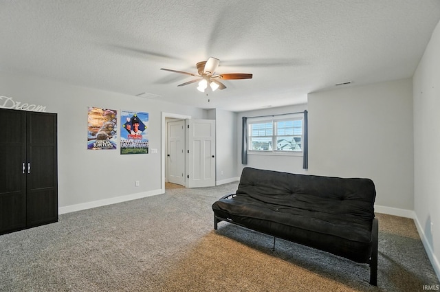 907 Switchfoot Dr, Huntertown, IN 46748 - sitting room with a ceiling fan, carpet, and a textured ceiling