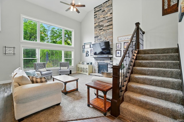 907 Switchfoot Dr, Huntertown, IN 46748 - living room with high vaulted ceiling, ceiling fan, healthy amount of natural light, stairs, and a fireplace
