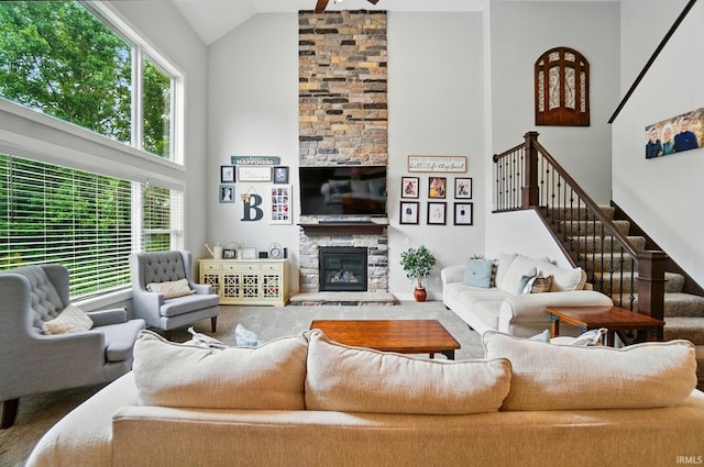 907 Switchfoot Dr, Huntertown, IN 46748 - living room with high vaulted ceiling, a fireplace, plenty of natural light, and stairs