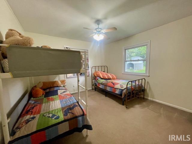 7210 W Dinsmore Rd, Bloomington, IN 47403 - bedroom featuring carpet and a ceiling fan