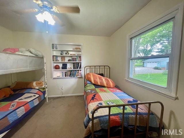 7210 W Dinsmore Rd, Bloomington, IN 47403 - carpeted bedroom with baseboards and a ceiling fan