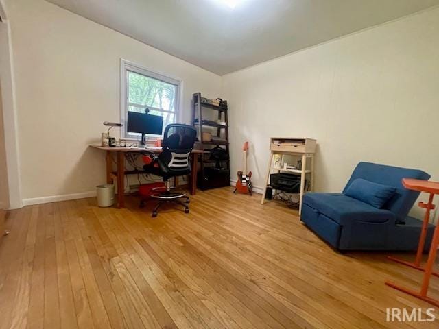 7210 W Dinsmore Rd, Bloomington, IN 47403 - home office featuring hardwood / wood-style floors and baseboards