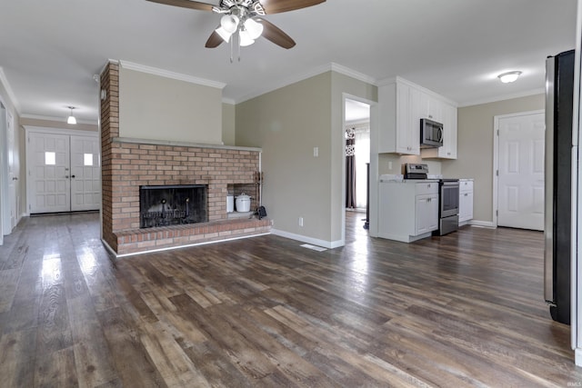 867 Park Plaza Dr, Evansville, IN 47715 - unfurnished living room with a ceiling fan, dark wood-style flooring, ornamental molding, and a brick fireplace