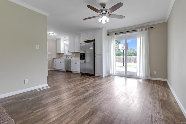 867 Park Plaza Dr, Evansville, IN 47715 - unfurnished living room featuring ceiling fan, ornamental molding, and dark wood-style flooring