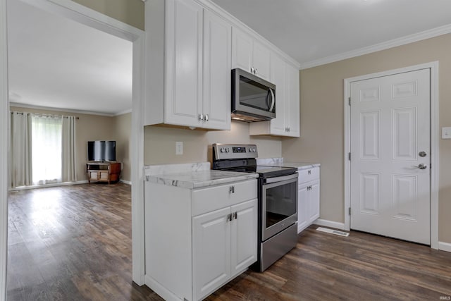 867 Park Plaza Dr, Evansville, IN 47715 - kitchen with stainless steel appliances, dark wood-style flooring, crown molding, light countertops, and white cabinetry