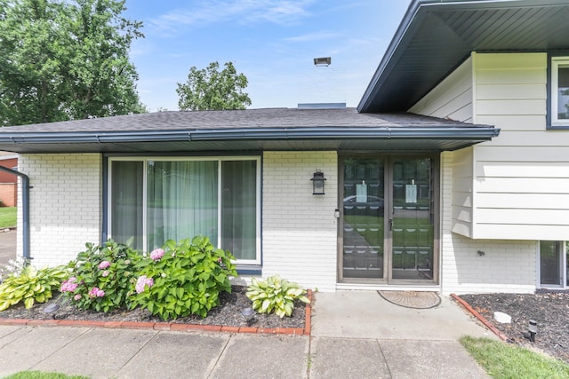 867 Park Plaza Dr, Evansville, IN 47715 - view of exterior entry with brick siding and roof with shingles