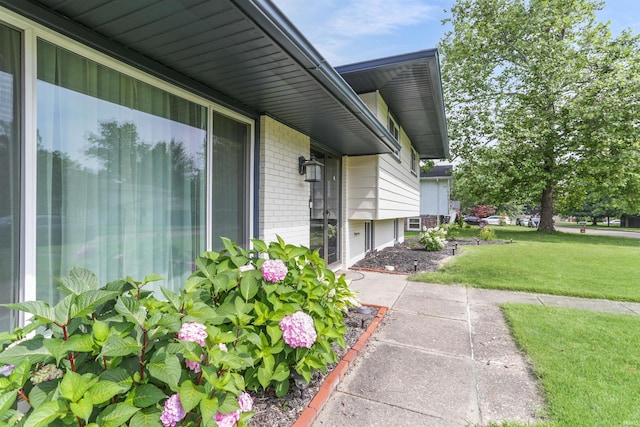 867 Park Plaza Dr, Evansville, IN 47715 - entrance to property with a lawn and brick siding