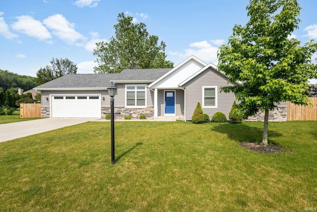 509 Janewood Ct, Goshen, IN 46526 - view of front facade with stone siding, driveway, a garage, and a shingled roof