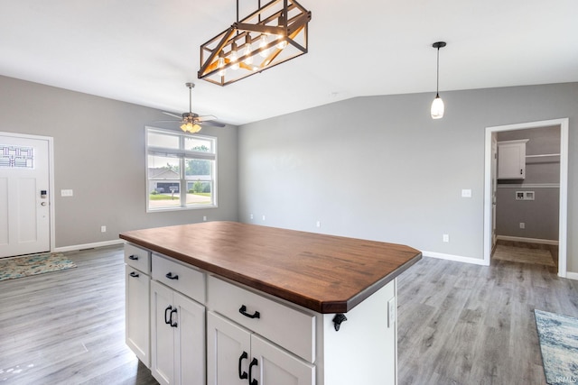 509 Janewood Ct, Goshen, IN 46526 - kitchen with wooden counters, light wood-style floors, a ceiling fan, lofted ceiling, and white cabinetry