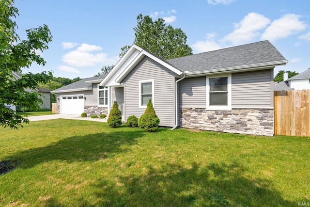 509 Janewood Ct, Goshen, IN 46526 - view of front of property featuring stone siding, an attached garage, concrete driveway, and roof with shingles