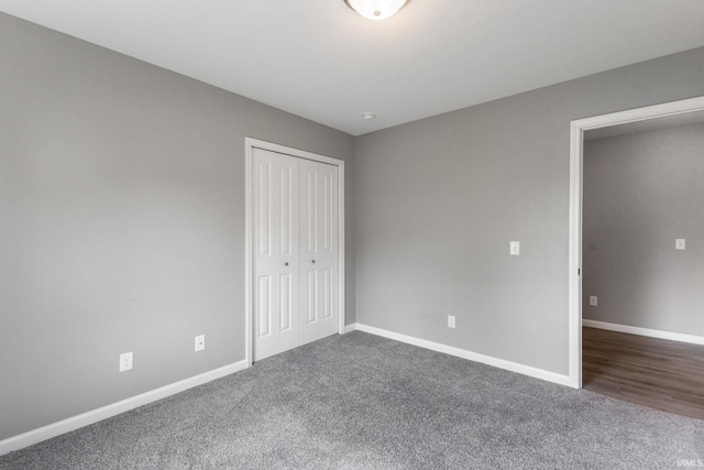 509 Janewood Ct, Goshen, IN 46526 - unfurnished bedroom featuring dark carpet and a closet