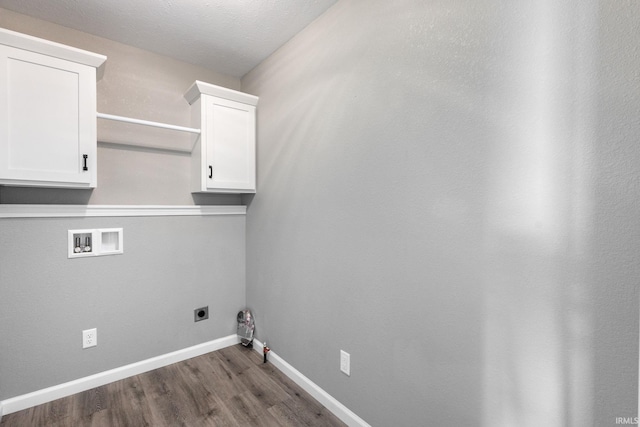 509 Janewood Ct, Goshen, IN 46526 - laundry area featuring hookup for a washing machine, dark wood-style floors, electric dryer hookup, and cabinet space
