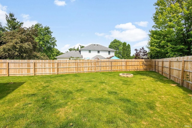 509 Janewood Ct, Goshen, IN 46526 - fenced backyard featuring a fire pit