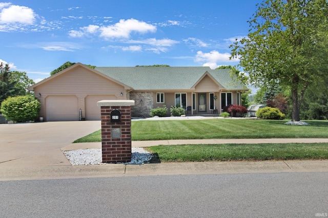 207 Meadows Dr, Greentown, IN 46936 - ranch-style house with an attached garage, concrete driveway, a front lawn, and a shingled roof