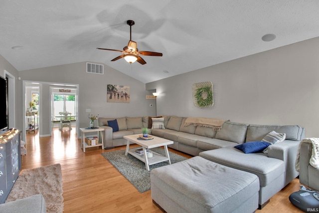 207 Meadows Dr, Greentown, IN 46936 - living room featuring light wood finished floors, vaulted ceiling, and a ceiling fan