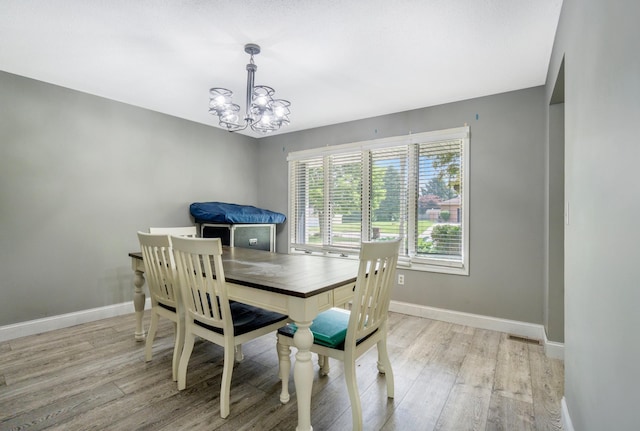 1006 Heather Rdg, Angola, IN 46703 - dining area with light wood-style flooring and a chandelier