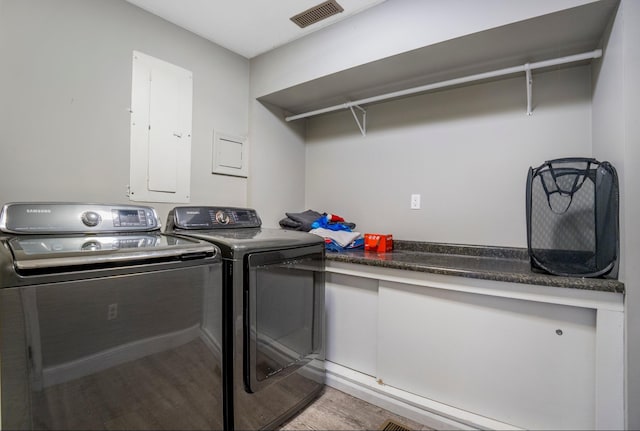 1006 Heather Rdg, Angola, IN 46703 - laundry area with electric panel, light wood-style floors, and separate washer and dryer