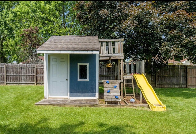 1006 Heather Rdg, Angola, IN 46703 - view of jungle gym with a fenced backyard and an outbuilding