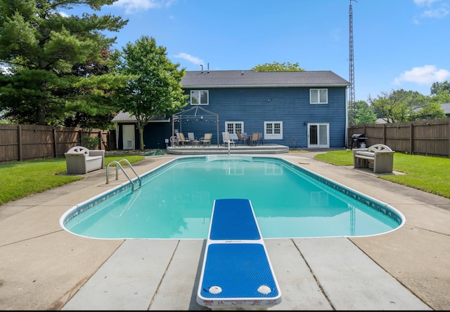 1006 Heather Rdg, Angola, IN 46703 - view of swimming pool featuring a fenced backyard, a patio area, a diving board, and a wooden deck