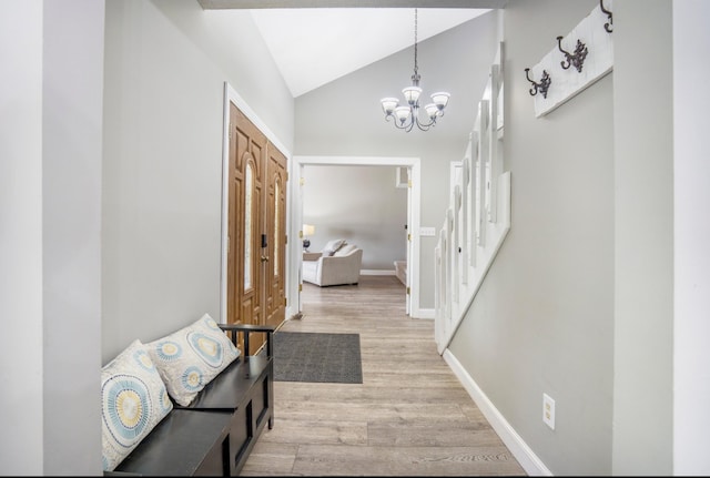 1006 Heather Rdg, Angola, IN 46703 - entrance foyer with light wood finished floors, vaulted ceiling, and a chandelier
