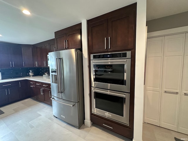32131 State Road 2nd Rd, New Carlisle, IN 46552 - kitchen with appliances with stainless steel finishes, decorative backsplash, light countertops, and dark brown cabinetry