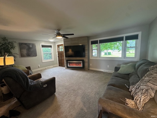 32131 State Road 2nd Rd, New Carlisle, IN 46552 - living room featuring a fireplace, a ceiling fan, and carpet flooring