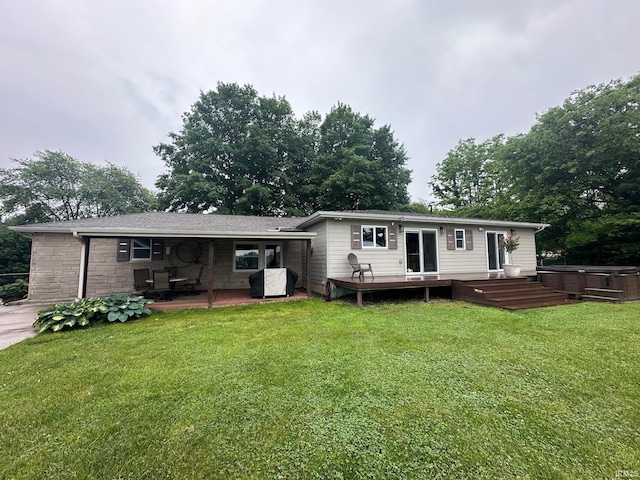 32131 State Road 2nd Rd, New Carlisle, IN 46552 - rear view of house featuring a hot tub, a deck, a patio area, and a yard