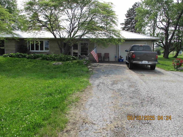 8487 N Old Highway 231st Rd, Linden, IN 47955 - ranch-style home featuring driveway, an attached garage, a metal roof, and a front lawn