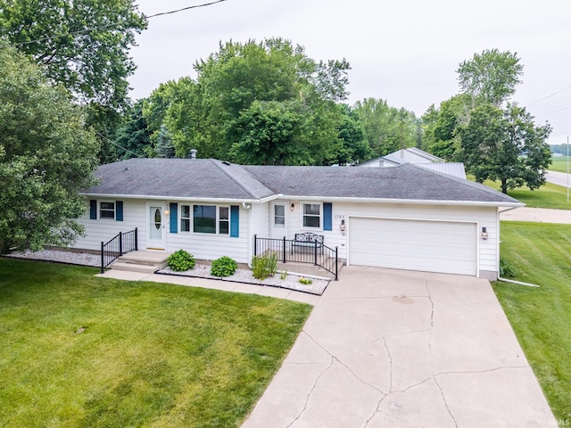 1703 Frantz Dr, North Manchester, IN 46962 - single story home featuring an attached garage, concrete driveway, a front lawn, and roof with shingles