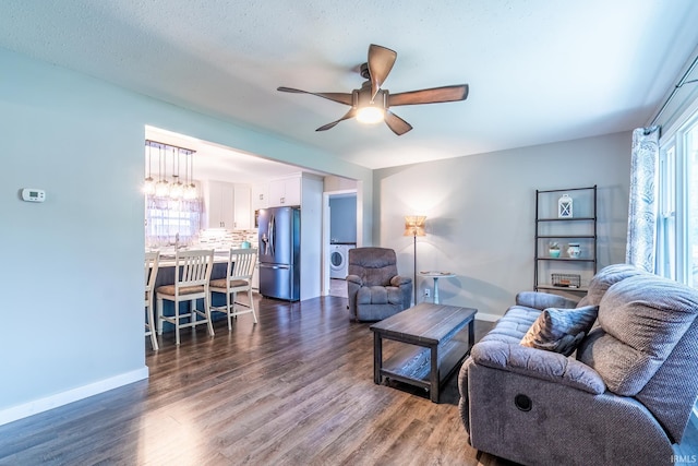 1703 Frantz Dr, North Manchester, IN 46962 - living room with washer / clothes dryer, ceiling fan, and dark wood-type flooring