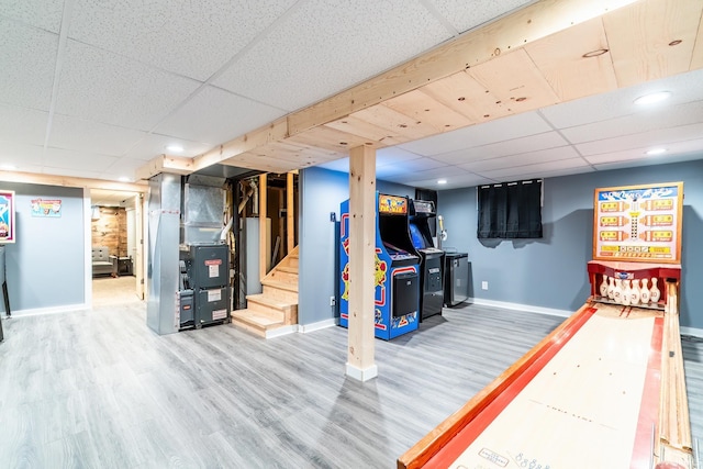 1703 Frantz Dr, North Manchester, IN 46962 - playroom with a drop ceiling, heating unit, wood finished floors, recessed lighting, and water heater