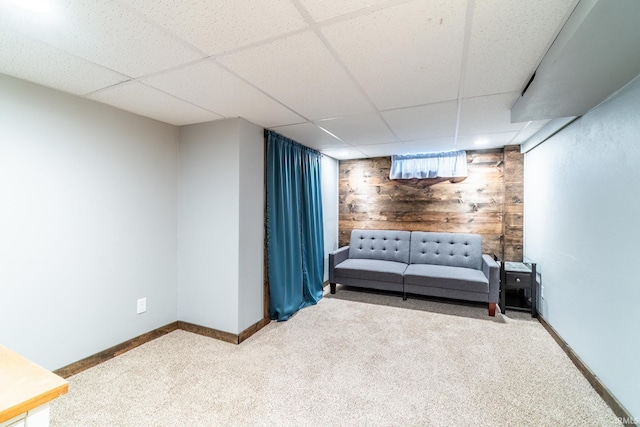 1703 Frantz Dr, North Manchester, IN 46962 - living area with carpet floors, wood walls, and a drop ceiling