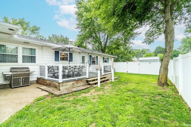 1703 Frantz Dr, North Manchester, IN 46962 - fenced backyard featuring a gate, a wooden deck, and a patio area