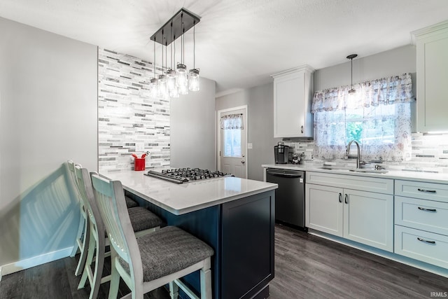 1703 Frantz Dr, North Manchester, IN 46962 - kitchen with dishwasher, decorative backsplash, a kitchen bar, and dark wood-style flooring