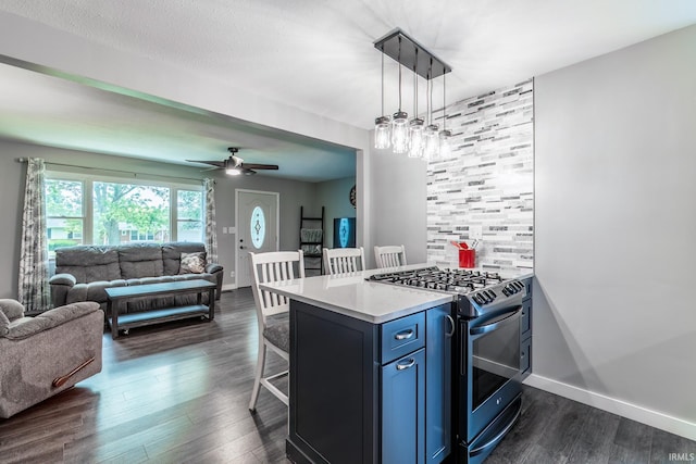 1703 Frantz Dr, North Manchester, IN 46962 - kitchen with range with gas stovetop, dark wood finished floors, a kitchen bar, open floor plan, and light countertops
