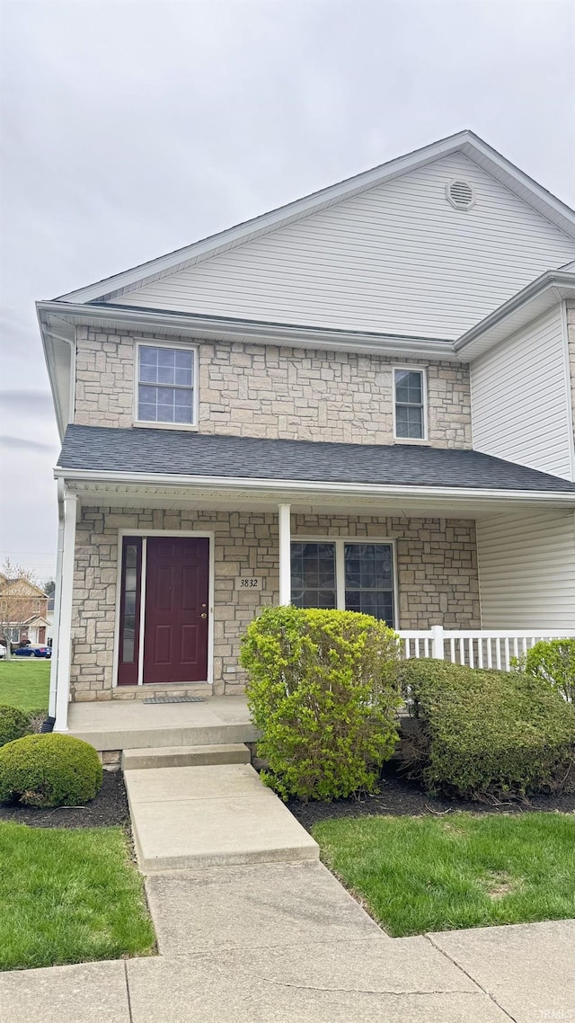 3832 E Cobble Creek Dr, Bloomington, IN 47401 - view of front facade featuring covered porch