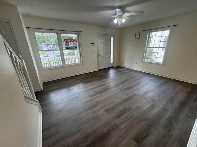 3832 E Cobble Creek Dr, Bloomington, IN 47401 - entryway featuring ceiling fan and dark wood-type flooring