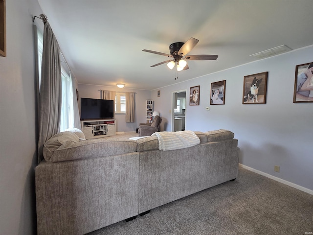 603 E 1st St, Fowler, IN 47944 - living area with a ceiling fan and carpet flooring