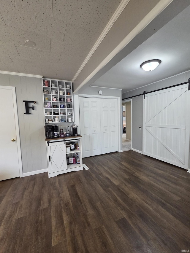 603 E 1st St, Fowler, IN 47944 - bar area featuring a barn door, wood finished floors, and ornamental molding