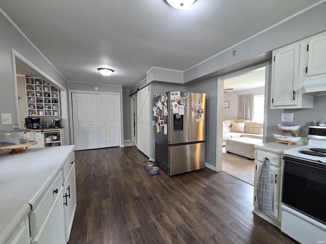603 E 1st St, Fowler, IN 47944 - kitchen with stainless steel refrigerator with ice dispenser, electric range, white cabinetry, light countertops, and dark wood finished floors