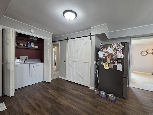 603 E 1st St, Fowler, IN 47944 - laundry room featuring washer and clothes dryer, dark wood-style floors, a barn door, and ornamental molding