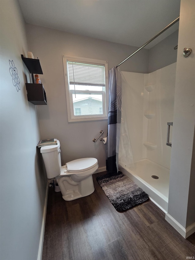 603 E 1st St, Fowler, IN 47944 - bathroom with wood finished floors and a shower with shower curtain