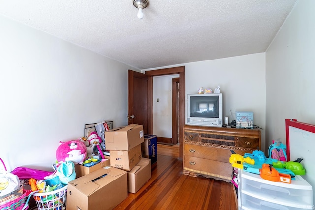 2130 N Wells St, Fort Wayne, IN 46808 - bedroom featuring a textured ceiling and wood finished floors