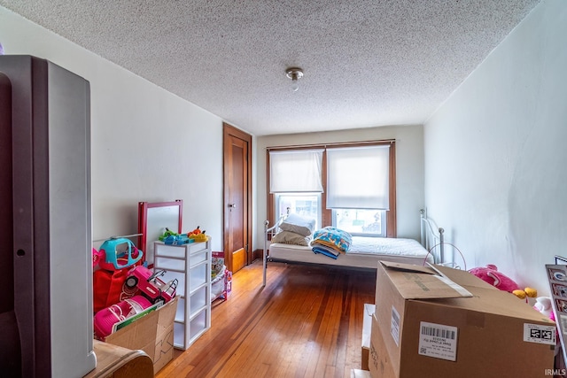 2130 N Wells St, Fort Wayne, IN 46808 - bedroom with a textured ceiling and hardwood / wood-style flooring