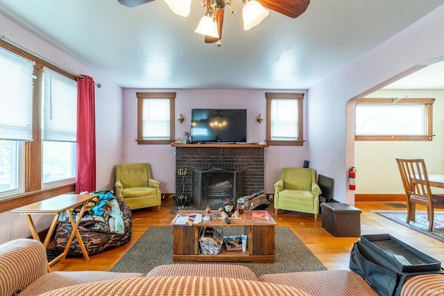 2130 N Wells St, Fort Wayne, IN 46808 - living area featuring ceiling fan, a fireplace, and wood finished floors