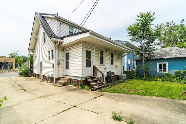 2130 N Wells St, Fort Wayne, IN 46808 - view of front of property with entry steps, a front lawn, and a metal roof